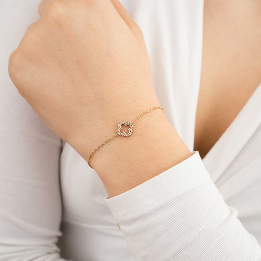 bloem armband goudkleurig